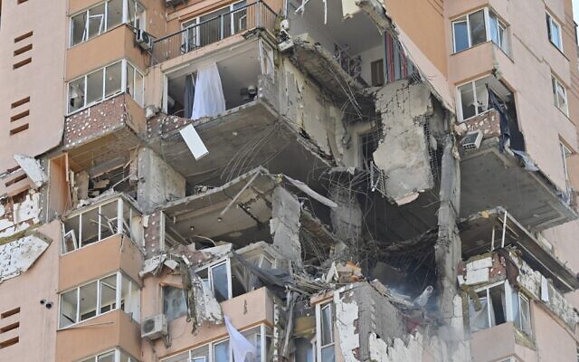 A view of a high-rise apartment block, which was hit by recent shelling in Kyiv, on February 26, 2022. (Genya Savilov/AFP)