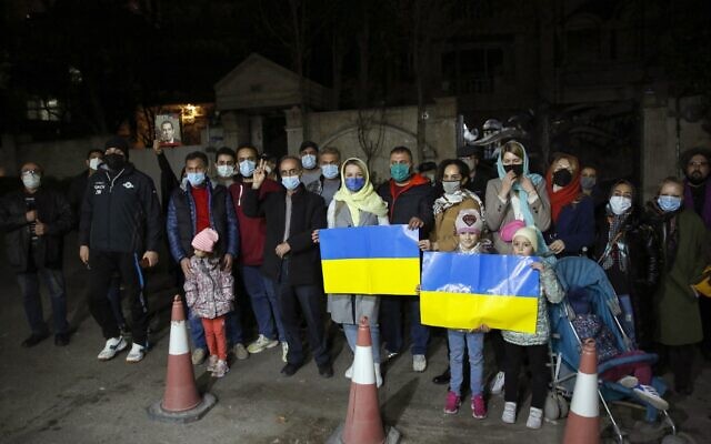 Iranians and Ukrainian nationals rally in front of the Ukraine embassy in Tehran to show support for Kyiv and protest the Russian invasion, on February 26, 2022. (Photo by AFP)