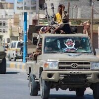 Yemeni pro-government fighters from the UAE-trained Giants Brigade drive though Ataq city, east of the Red Sea port of Aden, on their way to the frontline facing pro-Iran Houthi fighters, on January 28, 2022. (Saleh Al-OBEIDI/ AFP/ File)