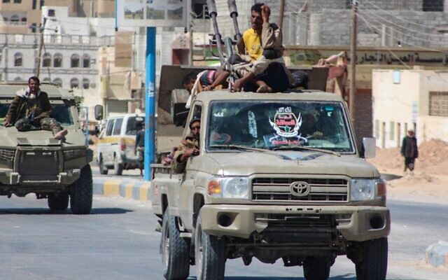 Yemeni pro-government fighters from the UAE-trained Giants Brigade drive though Ataq city, east of the Red Sea port of Aden, on their way to the frontline facing pro-Iran Houthi fighters, on January 28, 2022. (Saleh Al-OBEIDI/ AFP/ File)