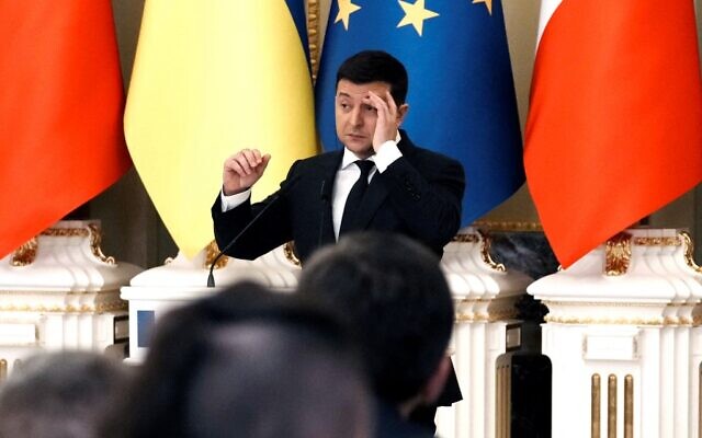Ukrainian President Volodymyr Zelensky gestures as he gives a joint press conference with French President following their meeting in Kyiv on February 8, 2022. (Thibault Camus / POOL / AFP)