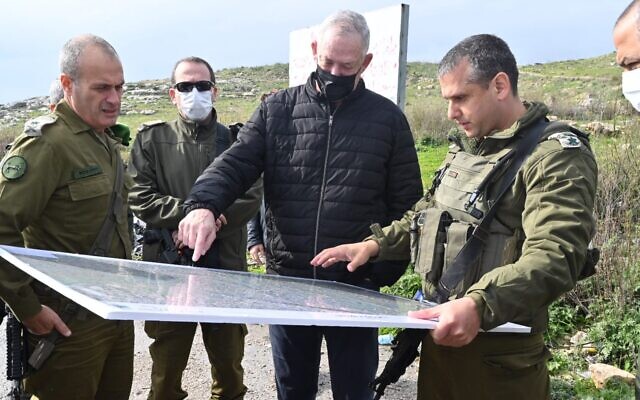 Defense Minister Benny Gantz, center, meets with top IDF officers during a tour of the West Bank, on February 1, 2022. (Ariel Hermoni/Defense Ministry)