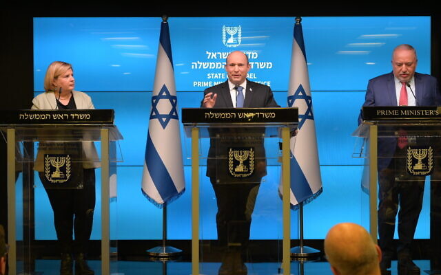 Prime Minister Naftali Bennett (C), Finance Minister Avigdor Liberman (R), and Economy and Industry Minister Orna Barbivai share the government's plan to address cost of living in a Jerusalem press conference, February 9, 2022. (Government Press Office)
