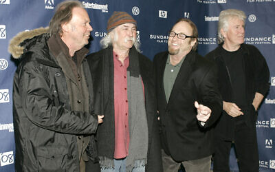 From left, Neil Young, David Crosby, Stephen Stills and Graham Nash sing together while on the red carpet for the premiere of their film 'CSNY Deja Vu' at the Sundance Film Festival in Park City, Utah, on Friday, Jan. 25, 2008. (AP Photo/Amy Sancetta)