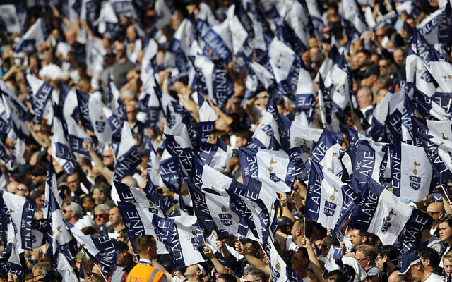 Tottenham Hotspur fans wave flags ahead of the English Premier League soccer match against Manchester United at White Hart Lane stadium in London, on May 14, 2017. (Frank Augstein/AP)