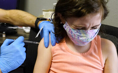 Illustrative -- A child receives a Pfizer COVID-19 vaccine in Sacramento, California, Jan. 25, 2022 (AP Photo/Rich Pedroncelli)