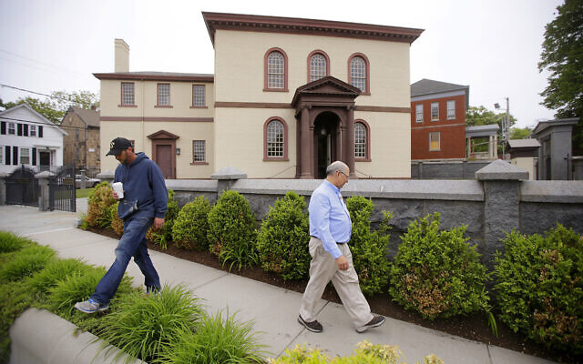 Employees Chuck Flippo, right, and Asa Montgomery walk through Patriots Park, May 28, 2015, at the Touro Synagogue, the nation's oldest, in Newport, Rhode Island (AP Photo/Stephan Savoia, File)