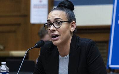 Emily Applegate, former marketing coordinator, premium client services and coordinator, ticket sales representative for the NFL's Washington Football Team, testifies before the House Oversight Committee during a roundtable "Examining the Washington Football Team's Toxic Workplace Culture" on Capitol Hill in Washington, Wednesday, Feb. 3, 2022. (Graeme Jennings/Pool via AP)