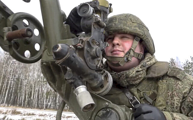 In this photo taken from video and released by the Russian Defense Ministry Press Service on February 4, 2022, a soldier takes part in the Belarusian and Russian joint military drills at Brestsky firing range, Belarus. (Russian Defense Ministry Press Service via AP)