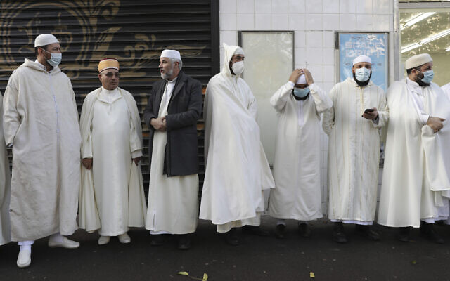 Imams from the Paris Mosque gather before paying their homage to the victims of the November 13, 2015 attacks, near the Bataclan concert hall in Paris, on Friday, November 12, 2021. (AP Photo/Adrienne Surprenant, File)