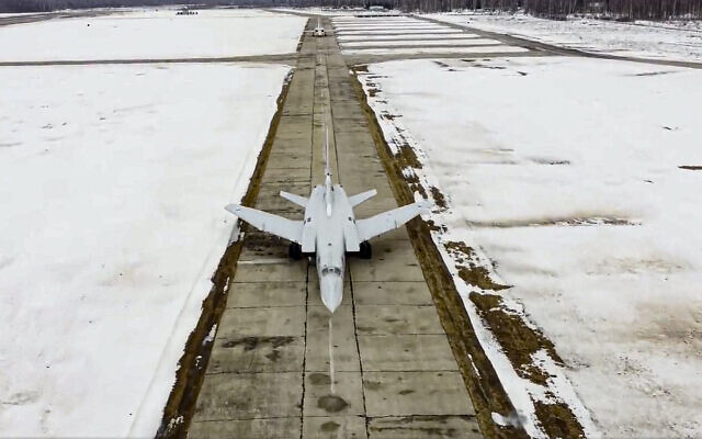 In this photo taken from video provided by the Russian Defense Ministry Press Service on Feb. 10, 2022, two long-range Tu-22M3 bombers of the Russian Aerospace Forces prepare to takeoff for patrolling in the airspace of Belarus during the Union Courage-2022 Russia-Belarus military drills in Belarus. (Russian Defense Ministry Press Service via AP)