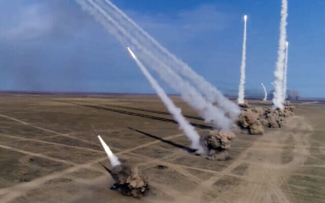 In this photo taken from a footage distributed by Russian Defense Ministry Press Service on Sept. 26, 2020, Russian rockets launch from missile systems during the main stage of the Kavkaz-2020 strategic command-and-staff exercises at the Kapustin Yar training ground, Russia.  (Russian Defense Ministry Press Service via AP)