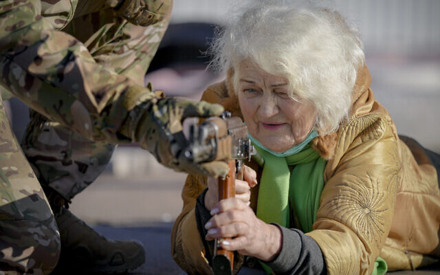 Valentyna Konstantynovska, 79 years-old, holds a weapon during basic combat training for civilians, organized by the Special Forces Unit Azov, of Ukraine's National Guard, in Mariupol, Donetsk region, eastern Ukraine, February 13, 2022. (AP Photo/ Vadim Ghirda)