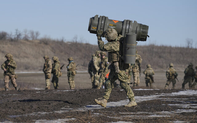 A Ukrainian serviceman carries an NLAW anti-tank weapon during an exercise in the Joint Forces Operation, in the Donetsk region, eastern Ukraine, Feb. 15, 2022. (AP/Vadim Ghirda, File)