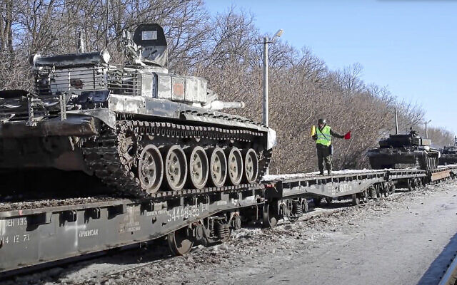 Russian army tanks are loaded onto railway platforms to move back to their permanent base after drills in Russia on Feb. 16, 2022. (Russian Defense Ministry Press Service via AP)