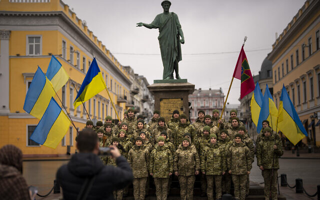 Ukrainian Army soldiers pose for a photo as they gather to celebrate a Day of Unity in Odessa, Ukraine, on Wednesday, February 16, 2022. (AP Photo/Emilio Morenatti)