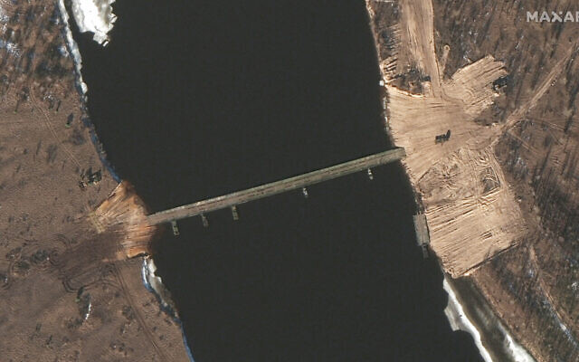 This February 15, 2022 satellite image provided by Maxar Technologies shows an overview of road construction and new pontoon bridge over the Pripyat River, Belarus. (Satellite image ©2022 Maxar Technologies via AP)