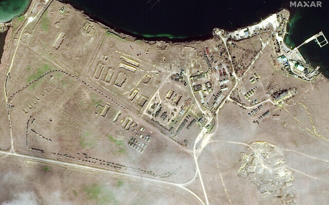This February 15, 2022 satellite image provided by Maxar Technologies shows military equipment positioned in convoy at Lake Donuzlav in Crimea. (Satellite image ©2022 Maxar Technologies via AP)