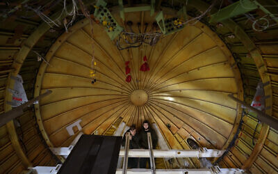 Engineers work on the conversion of a Boeing 767 passenger plane to a cargo plane at the Israel Aerospace Industries in Lod, near Tel Aviv, Israel, on January 25, 2022. (AP Photo/Oded Balilty)