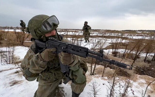 In this photo made from video provided by the Russian Defense Ministry Press Service on February 19, 2022, Russian marines take their position during the Union Courage-2022 Russia-Belarus military drills at the Obuz-Lesnovsky training ground in Belarus. (Russian Defense Ministry Press Service via AP)