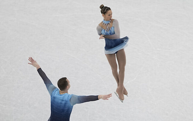 Hailey Kops and Evgeni Krasnopolski, of Israel, compete in the pairs free skate program during the figure skating competition at the 2022 Winter Olympics, Feb. 19, 2022, in Beijing. (AP Photo/Jeff Roberson)