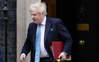 Britain's Prime Minister Boris Johnson leaves 10 Downing Street as he makes his way to parliament, to attend Prime Minister's Questions, in London, Feb. 23, 2022. (Alberto Pezzali/AP))