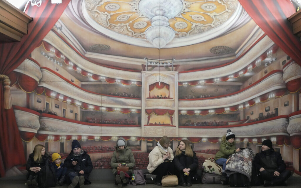 People rest in the Kyiv subway, using it as a shelter in Kyiv, Ukraine, February 25, 2022. (AP Photo/Efrem Lukatsky)
