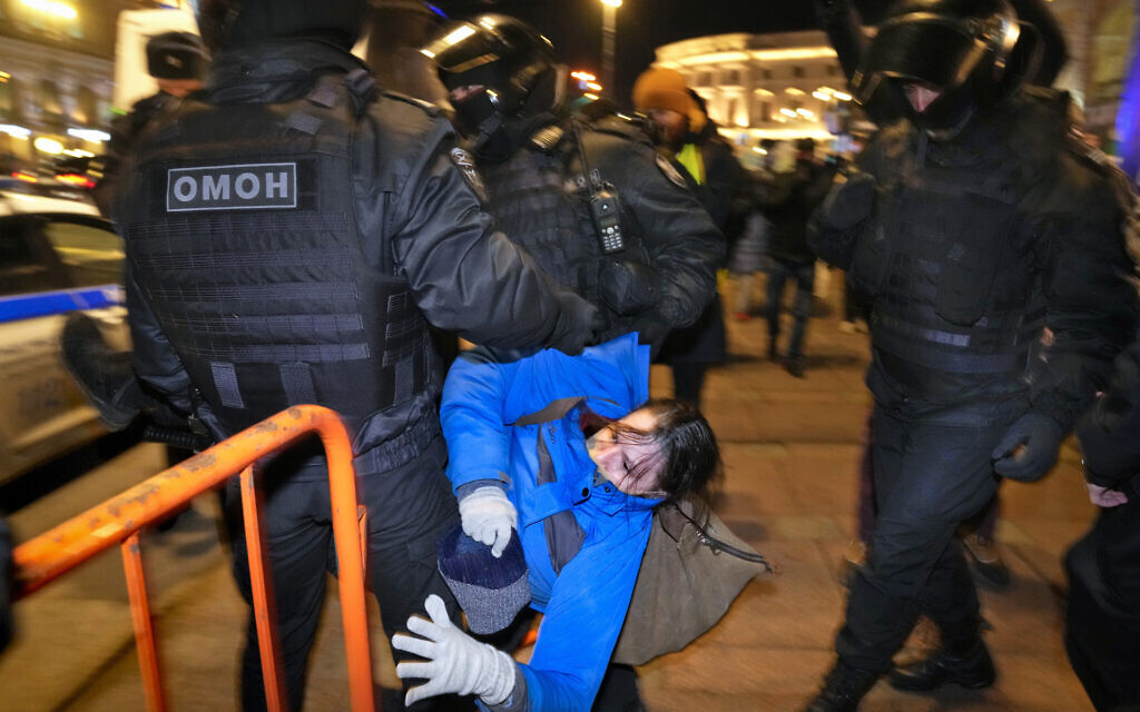 Police detain a demonstrator during an action against Russia's attack on Ukraine in St. Petersburg, Russia, February 26, 2022. (AP Photo/Dmitri Lovetsky)