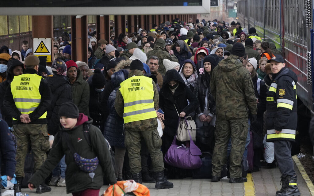 Refugees from Ukraine arrive to the railway station in Przemysl, Poland, Feb. 27, 2022 (AP Photo/Czarek Sokolowski)