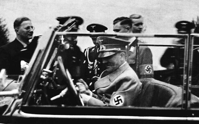 German Chancellor Adolf Hitler is shown sitting in his new Mercedes, a gift he received on his 50th birthday, in Berlin in this April 20, 1939 photo.   (AP Photo)