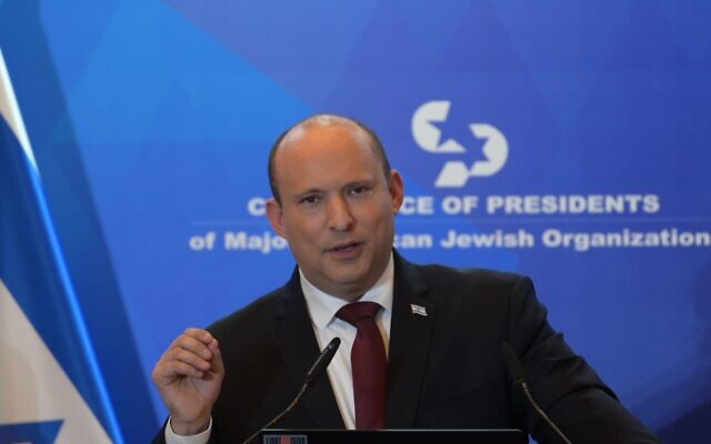 Prime Minister Naftali Bennett addresses the Conference of Presidents meeting in Jerusalem, on February 20, 2022. (Amos Ben Gershom/GPO)
