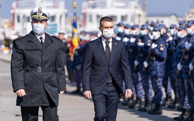 Israeli Ambassador to Romania David Saranga (right) and Romanian Rear Admiral Mihai Panait attend a commemoration ceremony for the victims of the drowning of the Struma ship on that event's 80th anniversary in Constanţa, Romania, on February 22, 2022. (Courtesy of the Israeli embassy in Romania via JTA)