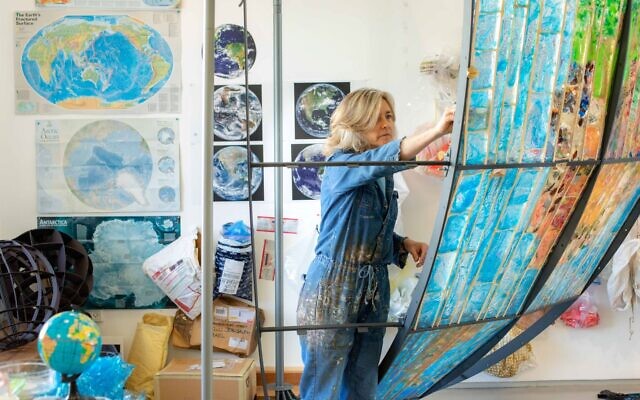 Artist Beverly Barkat working on her latest work, 'Earth Poetica,' at the Jerusalem aquarium starting on February 6, 2022. (Courtesy: Leopold Chen)