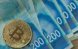 Illustrative: A coin bearing the Bitcoin logo, above several New Israeli Shekel banknotes. (Noam Revkin Fenton/Flash90)