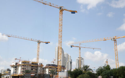A construction site of new residential buildings in a new neighborhood in Beer Yaakov, March 26,2020. (Flash90)