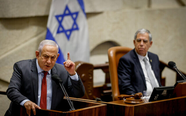 Head of opposition and head of the Likud party Benjamin Netanyahu (left) speaks during a plenum session at the Knesset in Jerusalem on February 7, 2022. (Olivier Fitoussi/Flash90)