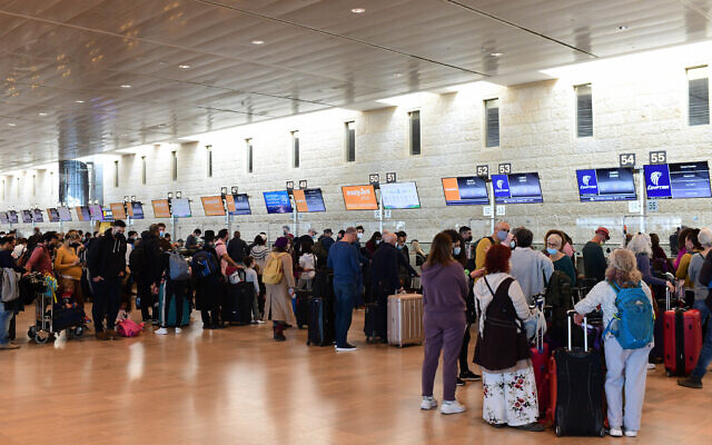 Travelers in the departure hall at Ben Gurion International Airport on February 13, 2022. (Tomer Neuberg/Flash90)