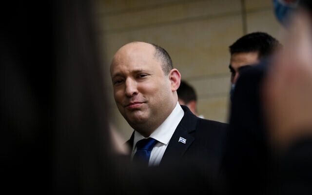 Prime Minister Naftali Bennett leaves his Knesset office, February 21, 2022. (Arie Leib Abrams/Flash90