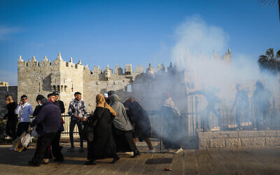 Police fire sound grenades at Palestinians at Damascus Gate in Jerusalem Old City, on February 28, 2022. (Flash90)