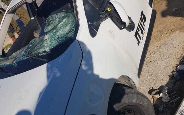 A taxi damaged after a driver was attacked in Nablus, on February 8, 2022. (Police spokesperson)