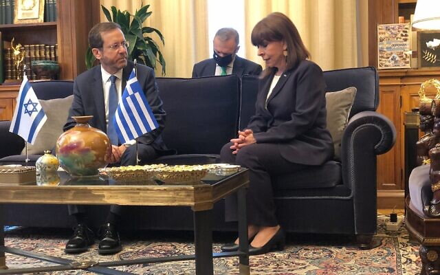 President Isaac Herzog meets in Athens with Greek President Katerina Sakellaropoulou on February 24, 2022. (Tal Schneider)