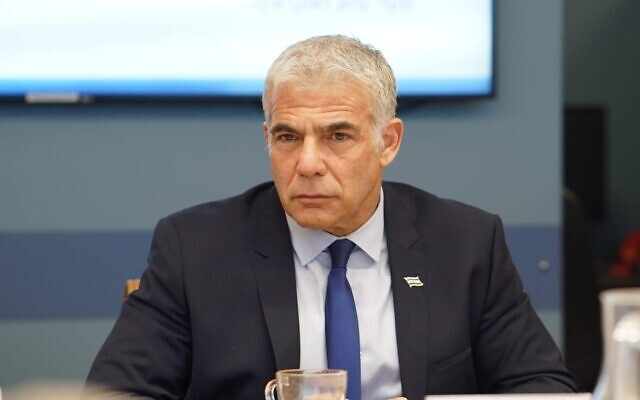 Foreign Minister Yair Lapid at a situational assessment on Russia's invasion of Ukraine, on February 24, 2022. (Niv Musman/GPO)