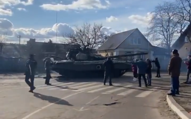 Residents of Bakhmach, Ukraine, attempt to stop Russian tanks from advancing toward the capital Kyiv, February, 26, 2022. (Screengrab/Twitter)