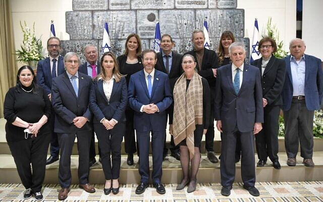 President Isaac Herzog poses for a photo with the winners of the 2022 Wolf Prize, at the President's Residence in Jerusalem, on February 8, 2022. (Kobi Gideon/GPO)