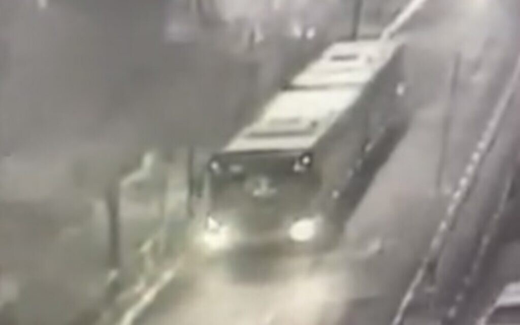 CCTV footage shows the moments a bus driving through Jerusalem was allegedly attacked and had its windows shattered, on February 2, 2022 (video screenshot)