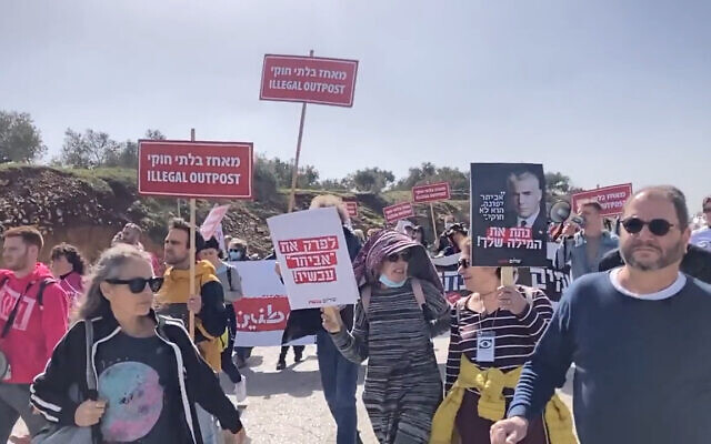 Left-wing activists and lawmakers march near the illegal West Bank outpost of Evyatar, February 18, 2022. (Screenshot: Twitter)