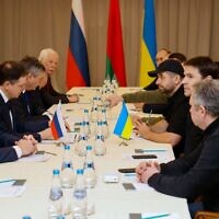 Members of delegations from Ukraine and Russia, including Russian presidential aide Vladimir Medinsky (2L), Ukrainian presidential aide Mykhailo Podolyak (2R), Volodymyr Zelensky's "Servant of the People" lawmaker Davyd Arakhamia (3R), hold talks in Belarus' Gomel region on February 28, 2022, following the Russian invasion of Ukraine. (Sergei KHOLODILIN / BELTA / AFP)
