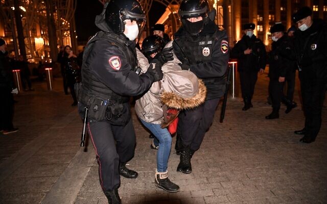 Police officers detain a person during a protest against Russia's invasion of Ukraine in central Moscow, on March 3, 2022. (AFP)
