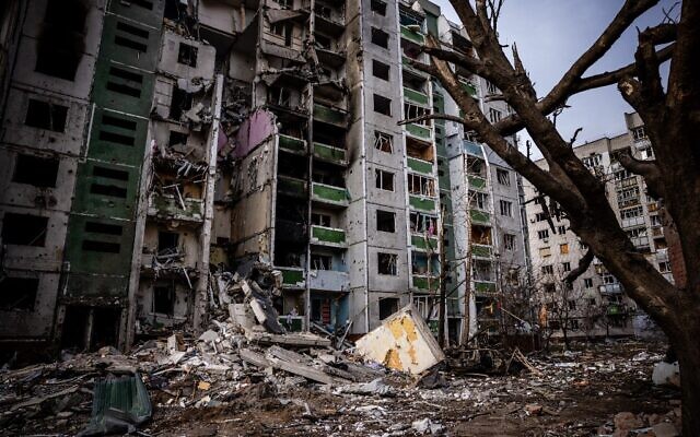This picture taken on March 4, 2022, shows a residential building damaged during a shelling the day before in the city of Chernihiv. (Dimitar Dilkoff/AFP)