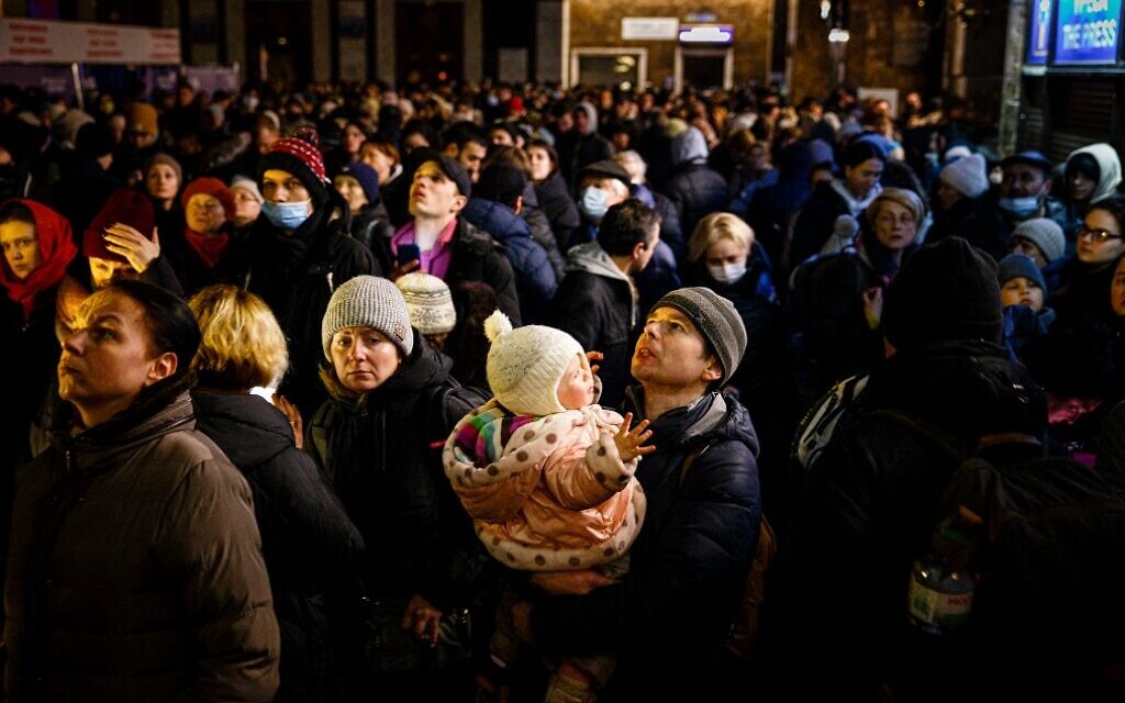 People wait to board an evacuation train at Kyiv central train station on March 5, 2022. (Dimitar Dilkoff/AFP)